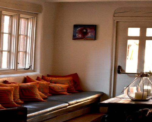A peaceful view of a rest corner inside a house showing soft light and comfortable seating space